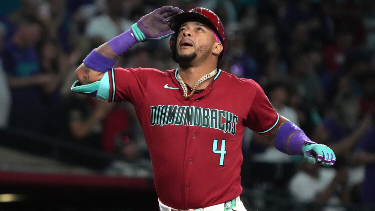 Arizona Diamondbacks' Ketel Marte reacts after hitting a solo home run against the Colorado Rockies...
