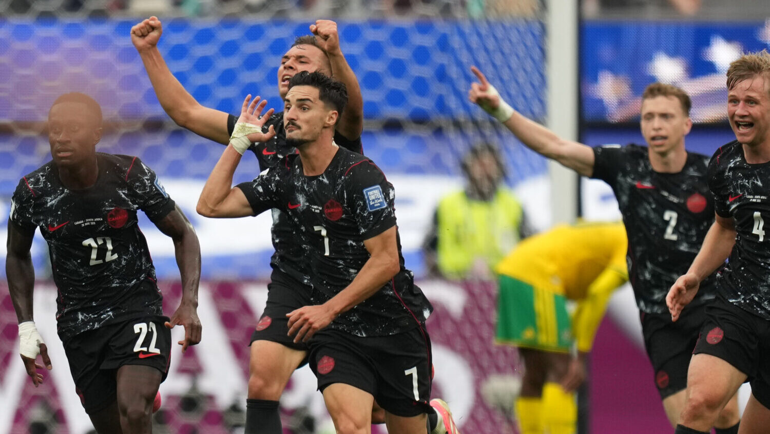 Canada's Stephen Eustaquio (7) celebrates scoring their opening goal against South Africa during th...