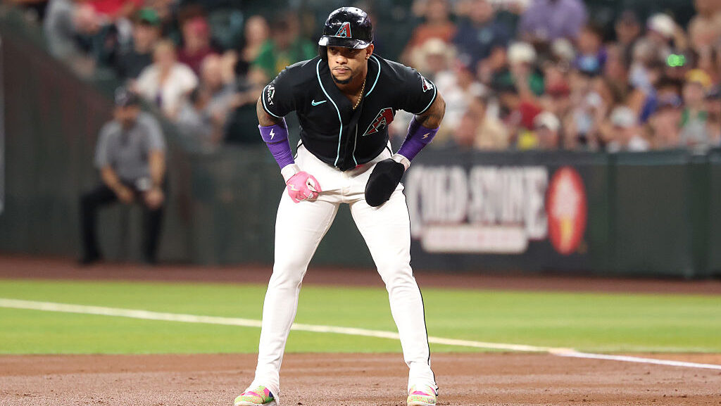 PHOENIX, ARIZONA - JULY 21: Ketel Marte #4 of the Arizona Diamondbacks leads off first base during ...