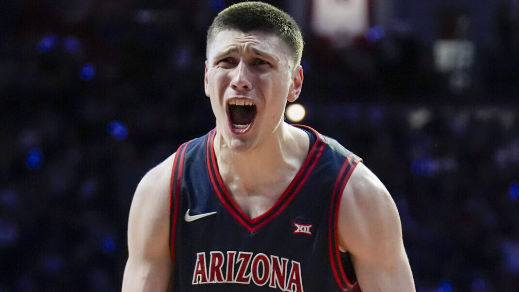 TUCSON, ARIZONA - FEBRUARY 18: Ivan Kharchenkov #8 of the Arizona Wildcats celebrates after scoring...