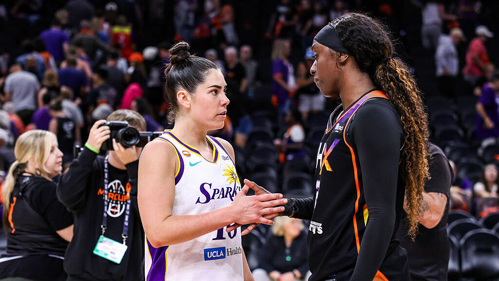 PHOENIX, ARIZONA - JUNE 13: Kelsey Plum #10 of the Los Angeles Sparks talks with Kahleah Copper #2 ...