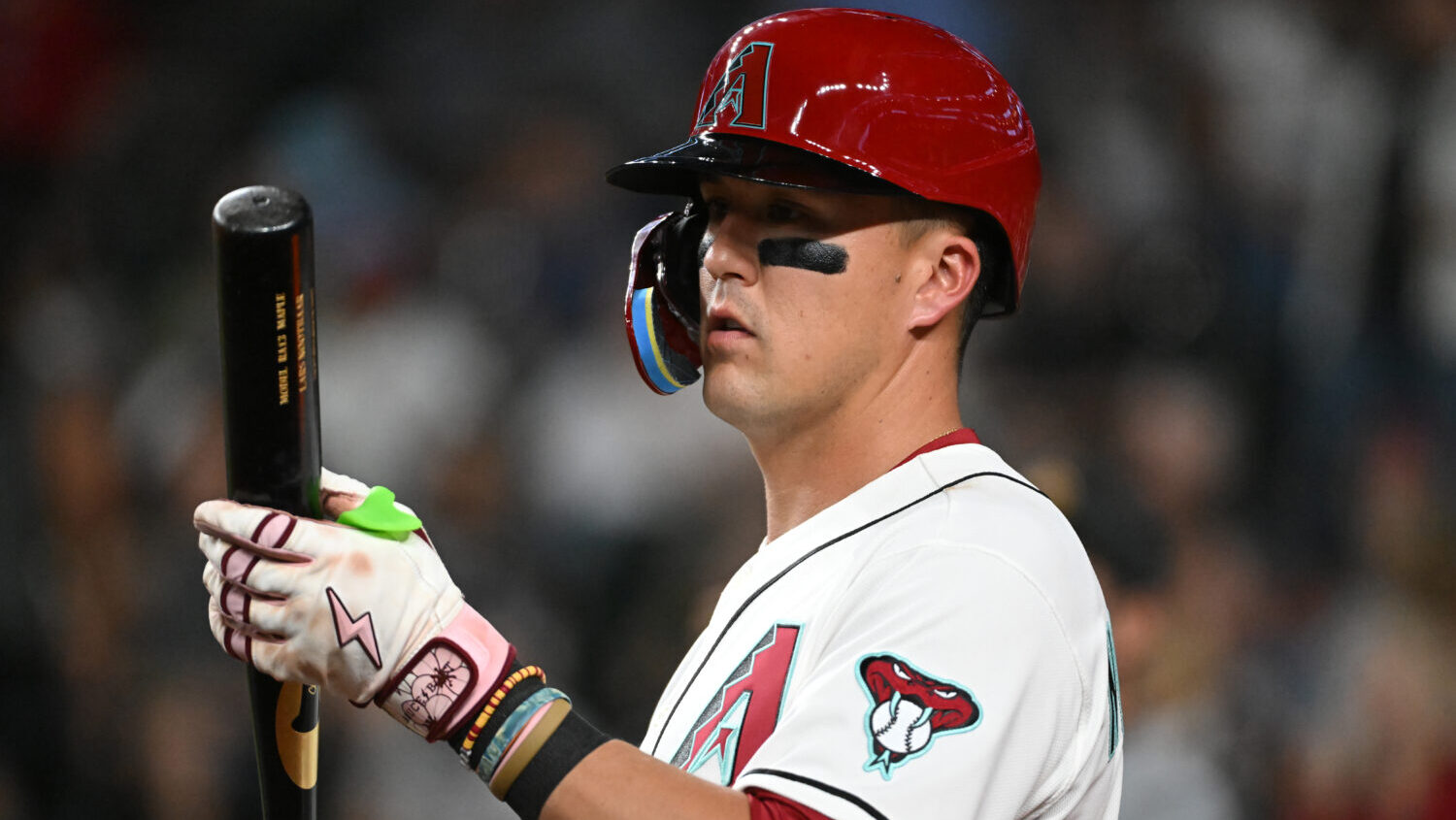 PHOENIX, ARIZONA - AUGUST 04: Lars Nootbaar #21 of the Arizona Diamondbacks gets ready in the on de...