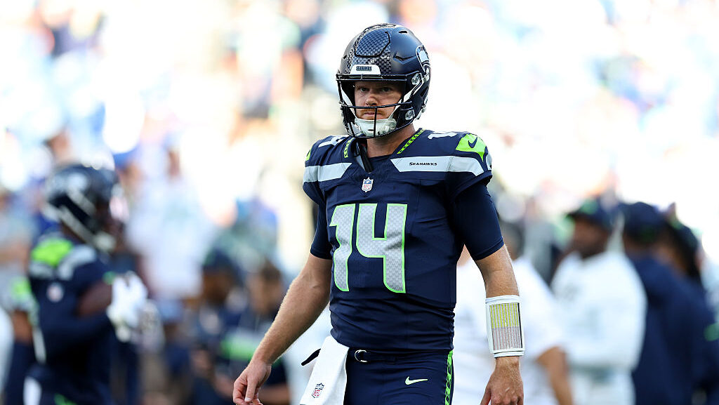 Sam Darnold #14 of the Seattle Seahawks looks on...