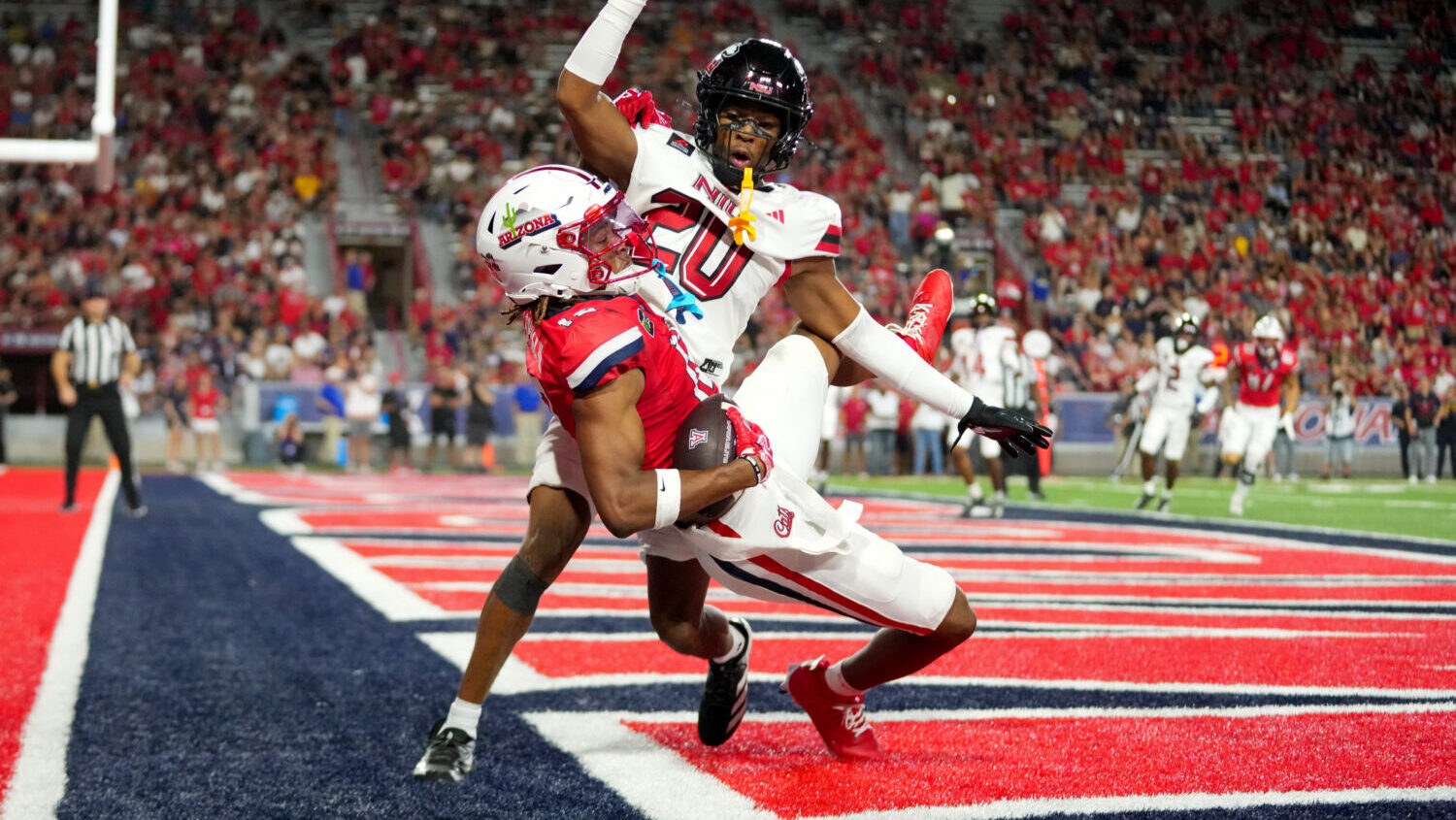 Tre Spivey #12 of the Arizona Wildcats catches a touchdown during the second quarter against the No...