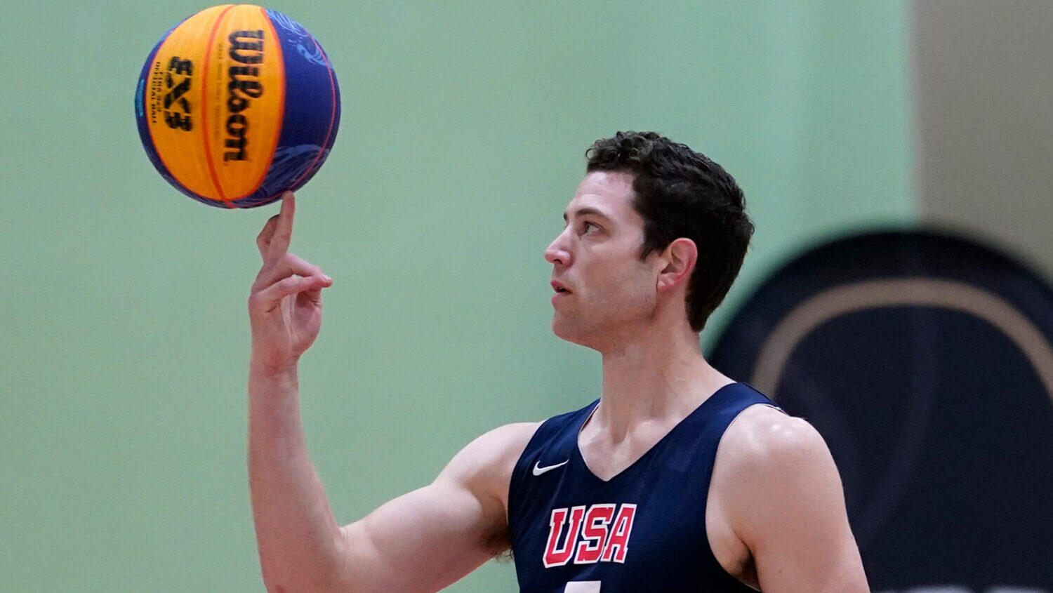 Jimmer Fredette spins a basketball during practice for the USA Basketball 3x3 national team....